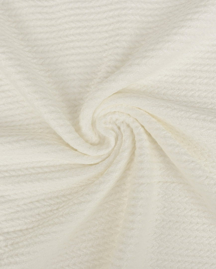 Attēls ar Adīts žakarda audums ar pīnēm - silti balts 350 g/m² – pieejams Šarlotes audumi