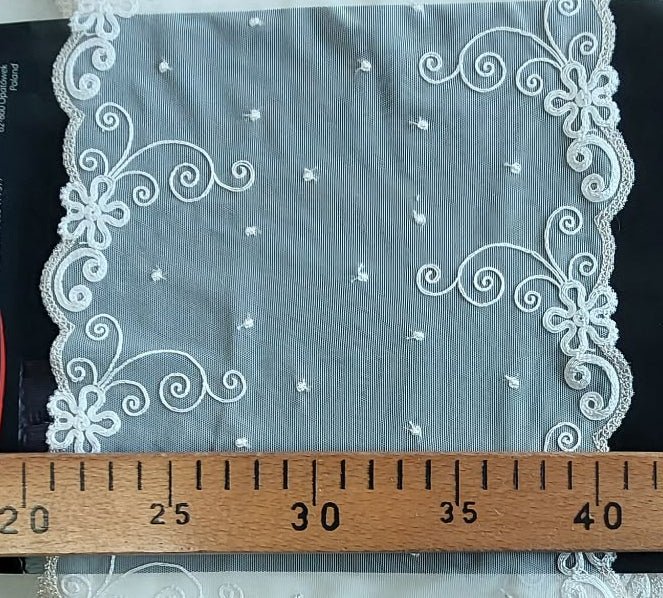 Image of 20 cm embroidered lace on tulle, milk white with gold accents – available online at Šarlotes audumi