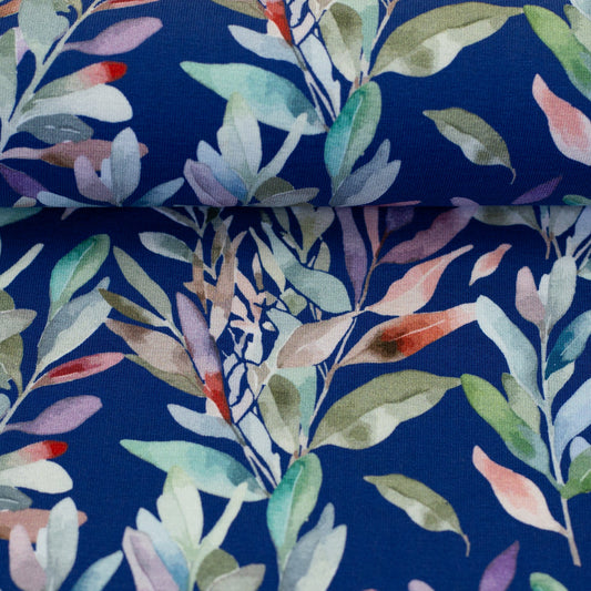 Kokvilnas trikotāža - lapas uz zila fona 200 g/m²