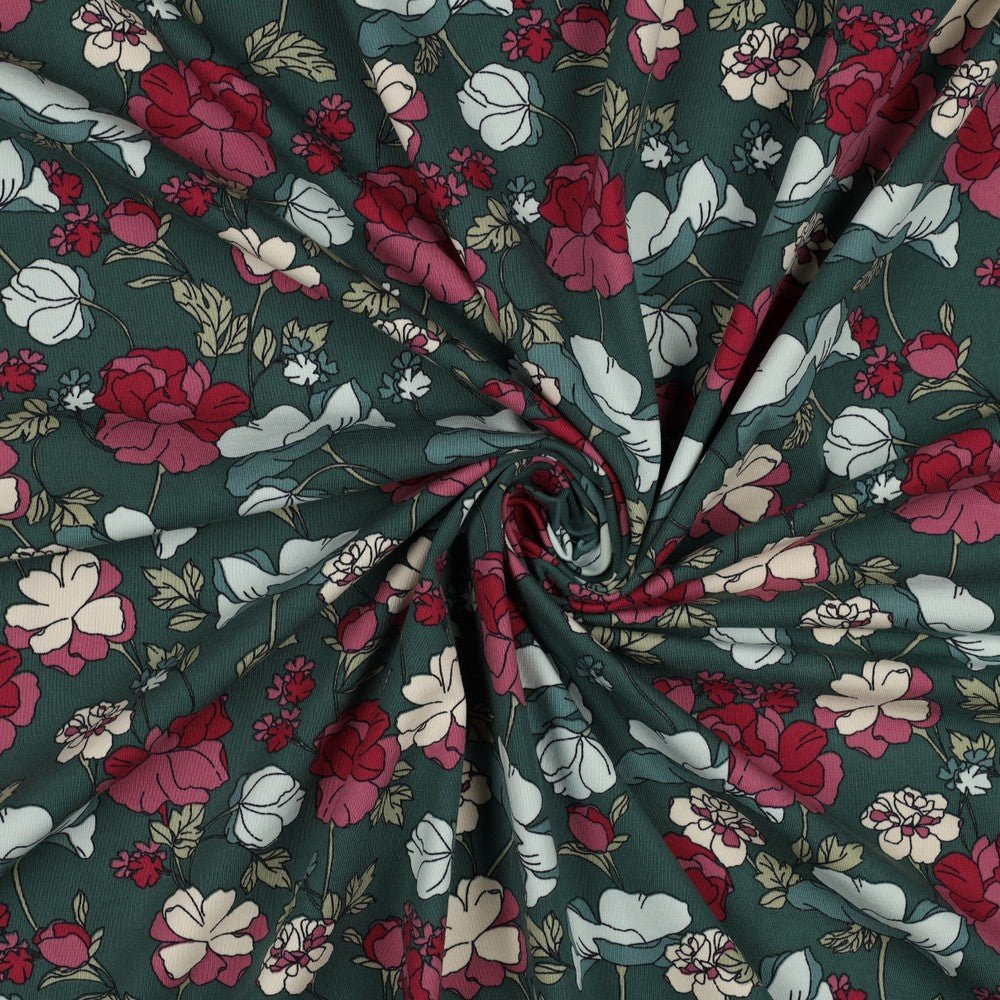 Kokvilnas trikotāža - puķes uz zaļa fona 200 g/m²
