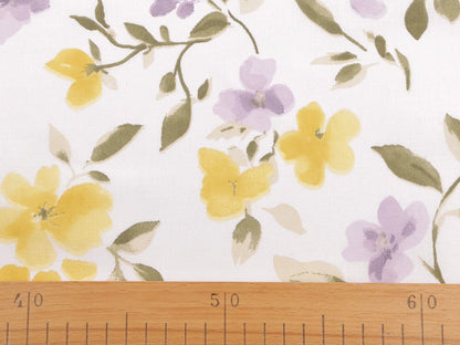 Image of 100% cotton fabric with yellow and lilac flowers – available online at Šarlotes audumi