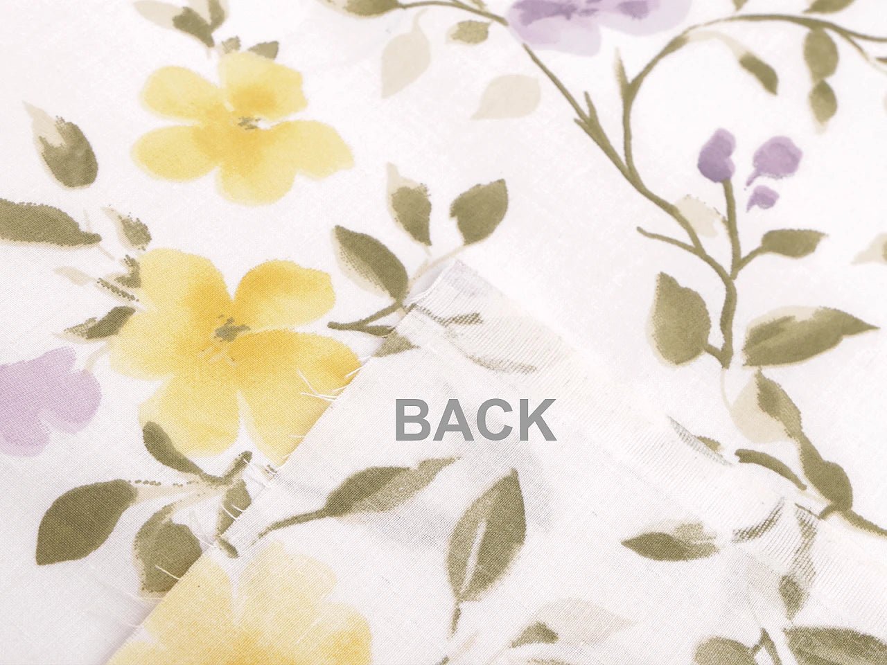 Image of 100% cotton fabric with yellow and lilac flowers – available online at Šarlotes audumi