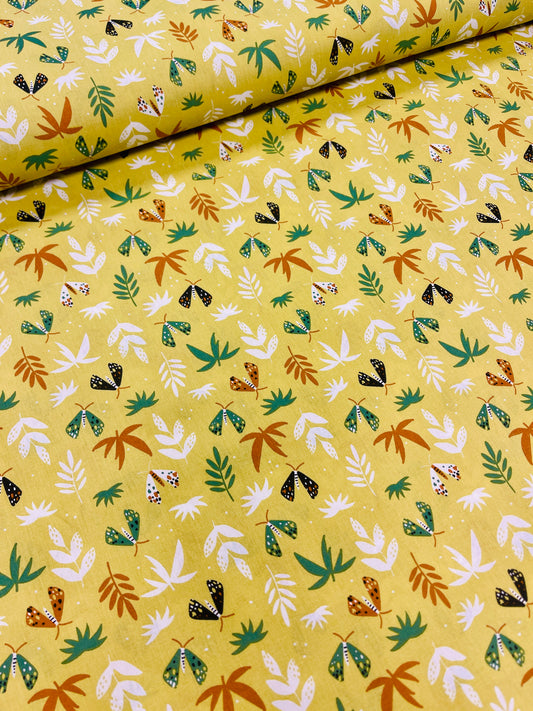 100% Kokvilnas audums-lapiņas uz dzeltenzaļa fona 125 g/m²