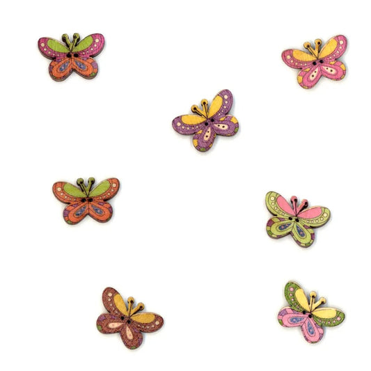Image of a decorative butterfly-shaped wooden button – 25 mm – available online at Šarlotes audumi