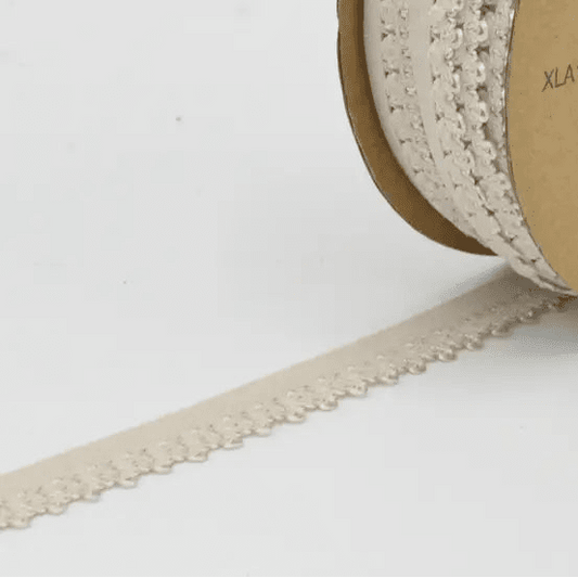 Attēls ar Elastīga gumija, mežģīne 1,3 cm - gaiši bēša – pieejams Šarlotes audumi