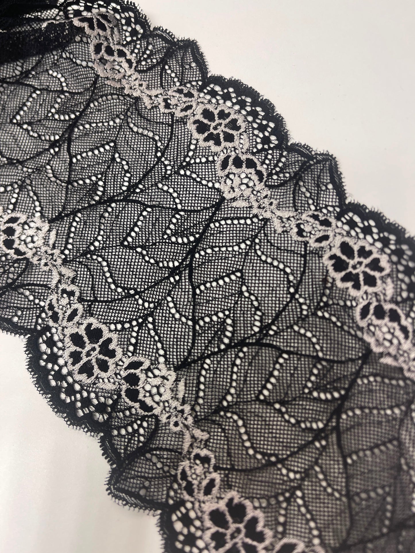 Image of 18 cm black elastic lace with white flowers – available online at Charlotte's Fabrics
