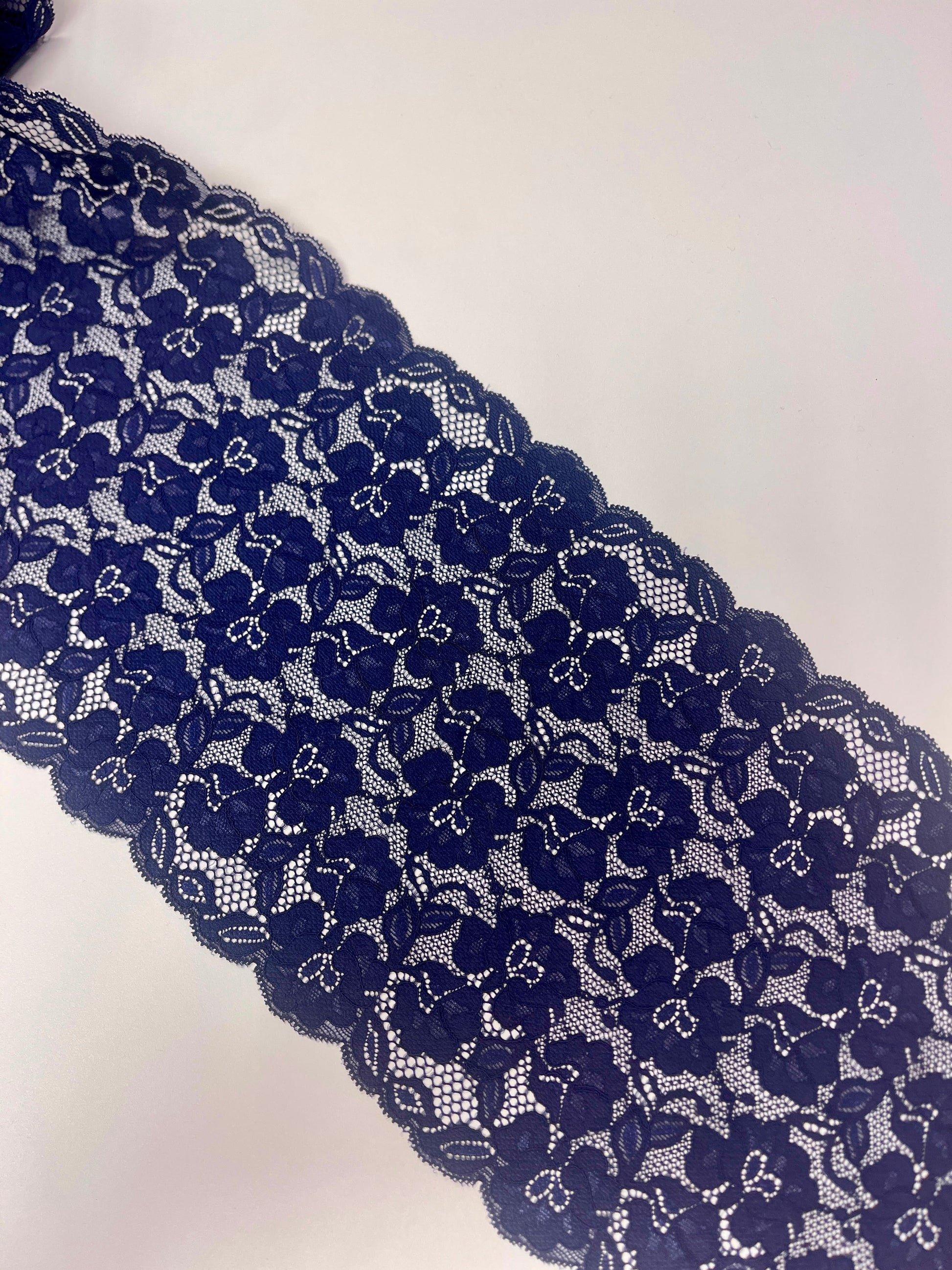 Image with 20 cm elastic lace - dark blue flowers, available online at Charlotte's Fabrics