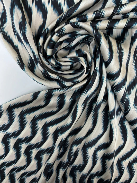 Attēls ar Itālijas satīna audums bēši zils ar abstraktu rakstu 85 g/m2 – pieejams Šarlotes audumi