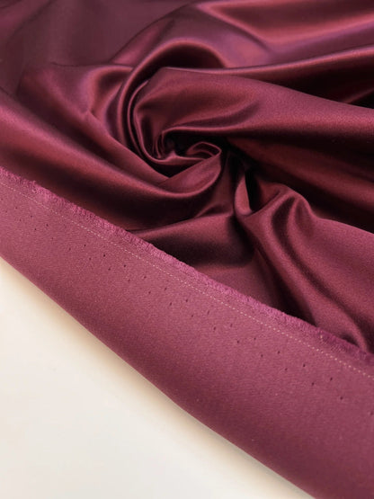Image of Italian silk and cotton satin fabric in a dark purple shade – available online at Charlotte's Fabrics