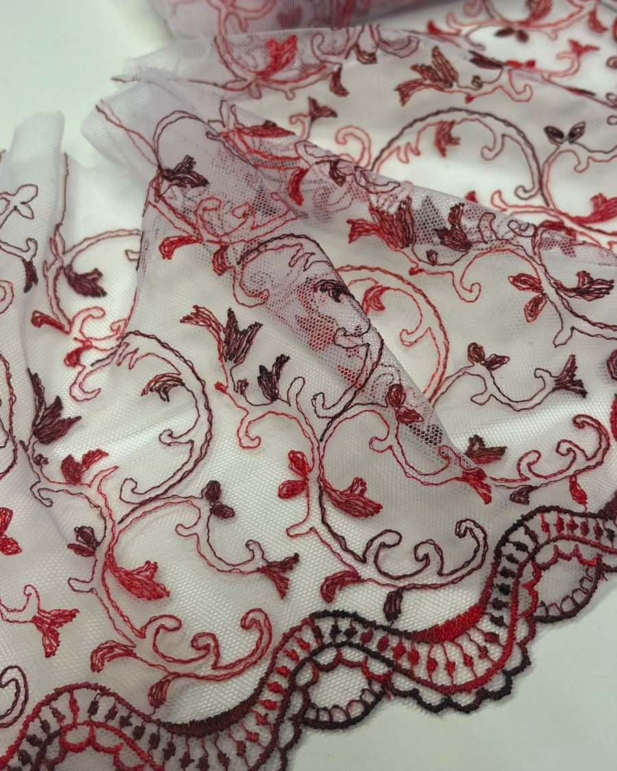 Image of embroidered lace on tulle, 20 cm, white with red accents – available online at Šarlotes audumi