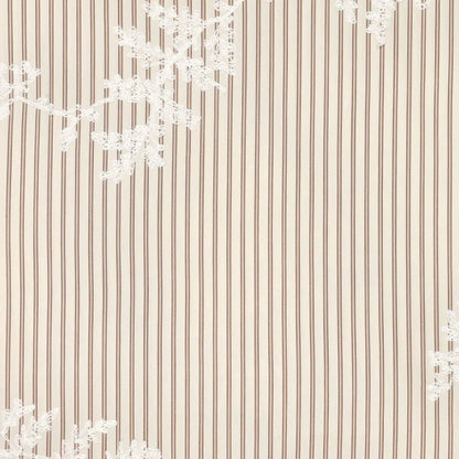 Image of embroidered cotton fabric with lines and white embroidered flowers – available online at Charlotte's Fabrics