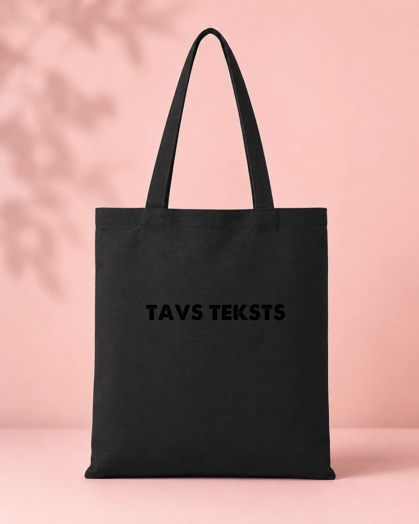 Image of a black cotton fabric bag with your text – available online at Šarlotes audumi