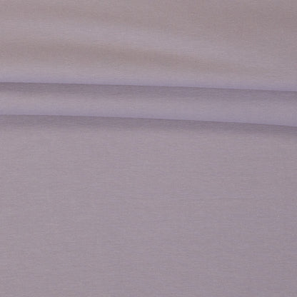 Image with cotton loopback jersey fabric in smoky lilac pink – available online at Šarlotes audumi