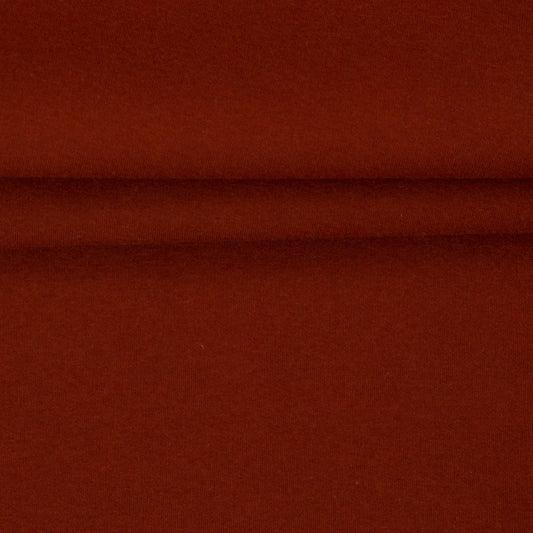 Image of terracotta cotton-lined knit fabric – available online at Šarlotes audumi