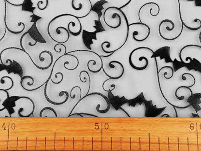Image of black organza with bat Halloween decorations – available online at Charlotte's Fabrics