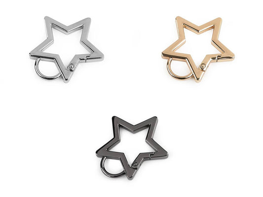 Attēls ar Metāla karabīne zvaigznes formā – 12 mm|dažādu toņu – pieejams Šarlotes audumi