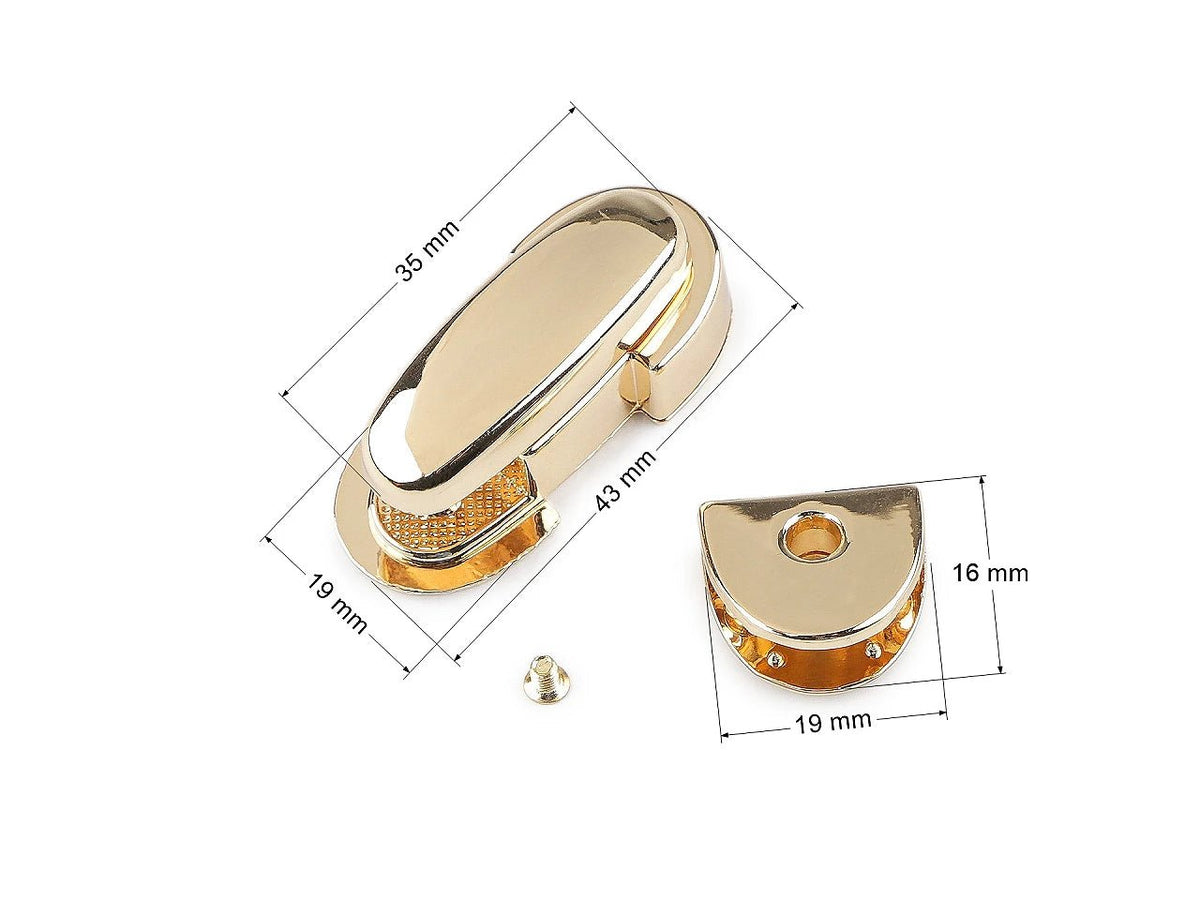 Attēls ar Metāla somas aizdare / slēdzene 19 × 43 mm – pieejams internetā Šarlotes audumi