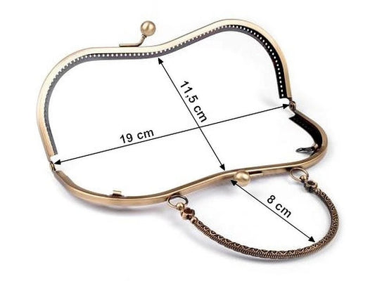 Attēls ar Metāla somiņas rāmis piešūšanai ar rokturi 5 × 8 cm| dažādu toņu – pieejams Šarlotes audumi