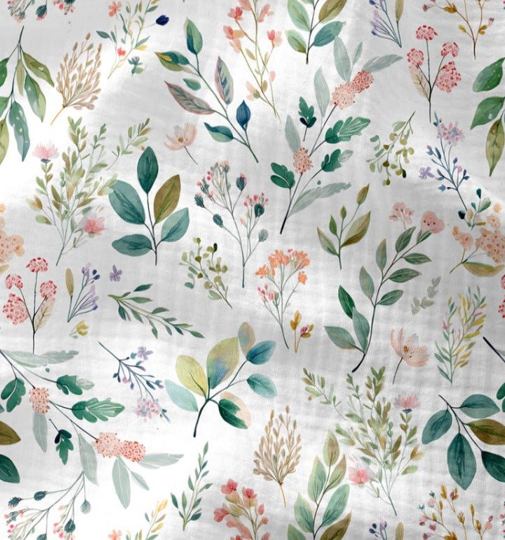 Attēls ar Muslīns - dabiskas lapotnes un ziedu motīvi 120 g/m² – pieejams Šarlotes audumi