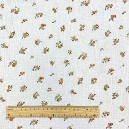 muslin - flowers on an orange background 130 g/m²