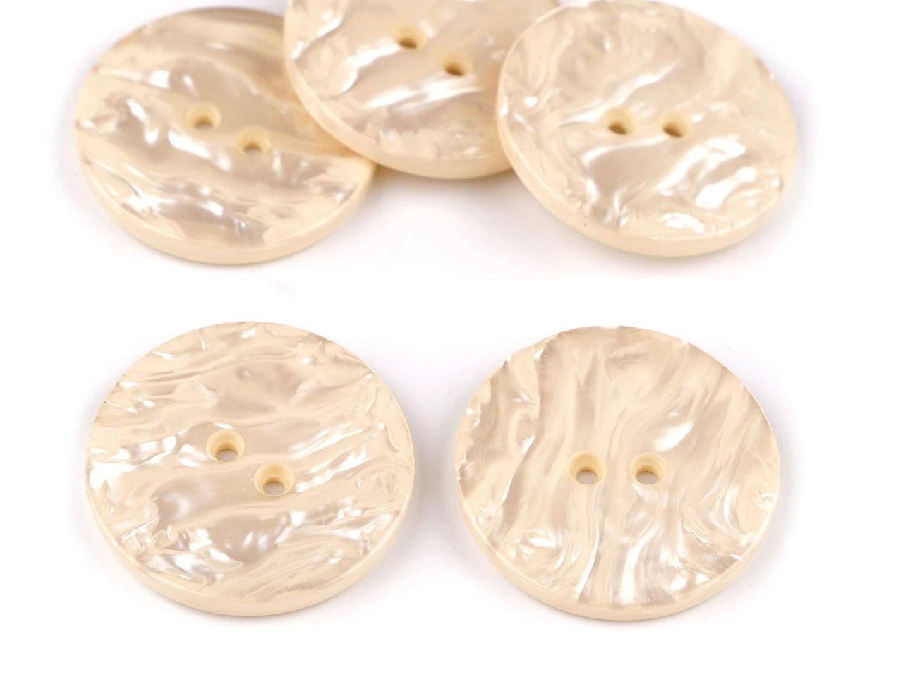 Image of 35 mm cream plastic buttons – available at Charlotte's Fabrics