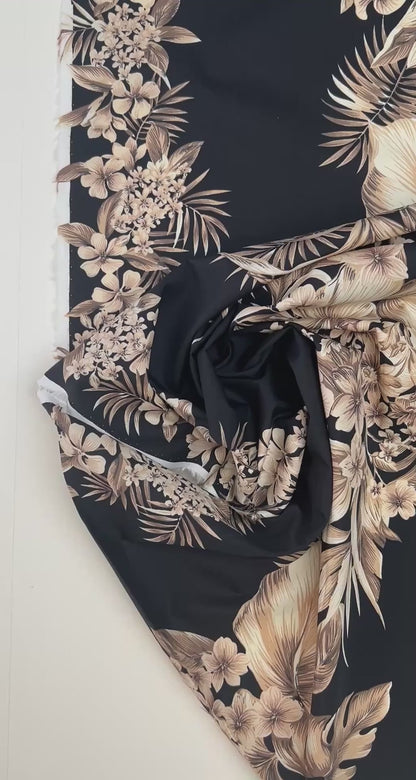 Italian cotton fabric with tropical floral pattern on a black background