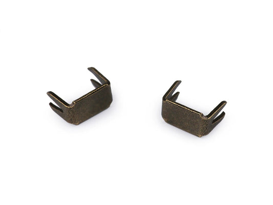 Image of zipper metal end stop No. 3 – 3 × 5 mm, antique bronze, available online at Šarlotes audumi