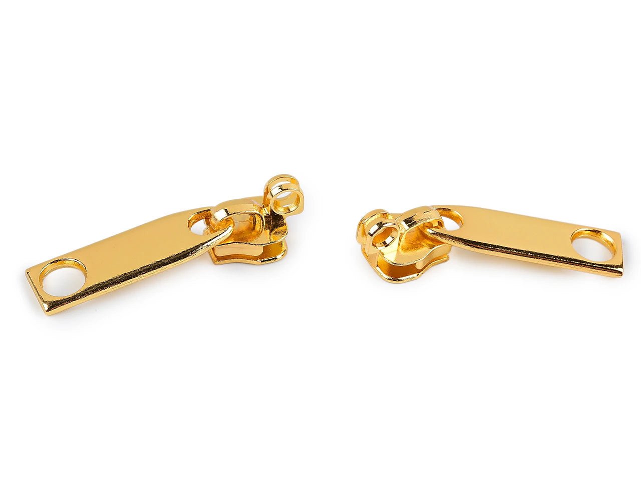 Image with zipper slider for coil zippers No. 7 – gold – available online at Charlotte Fabrics