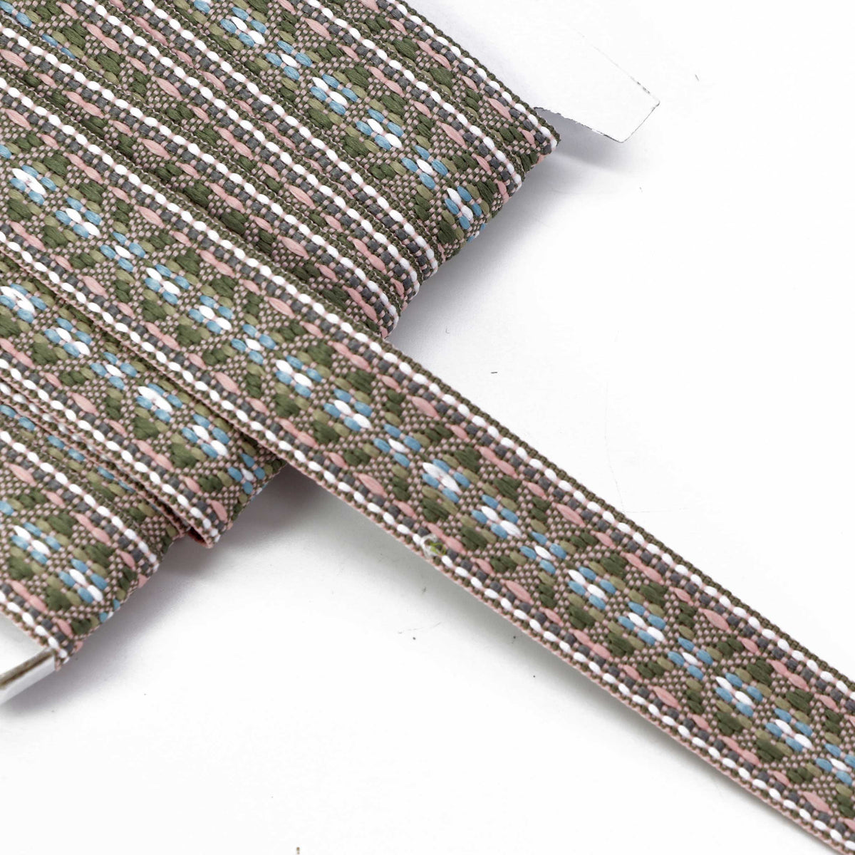 Image with folk ribbon, 20 mm belt—olive green, pink, blue, white and gray—available online at Šarlotes audumi