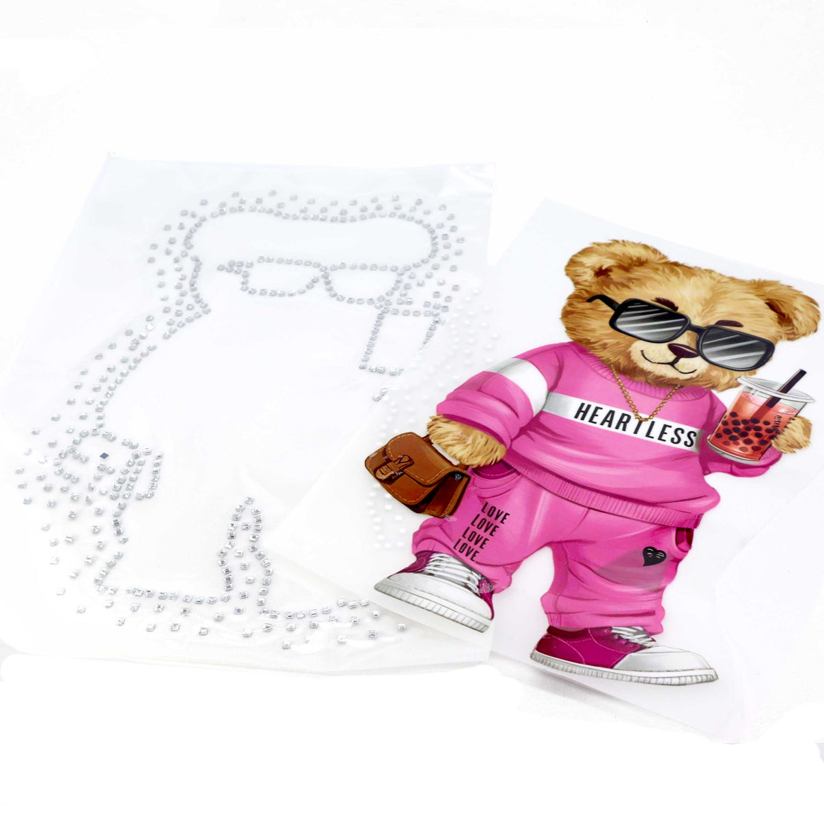 Image of thermal applique “Teddy Bear in Pink Sportswear” – 29 × 20 cm – available online at Šarlotes audumi