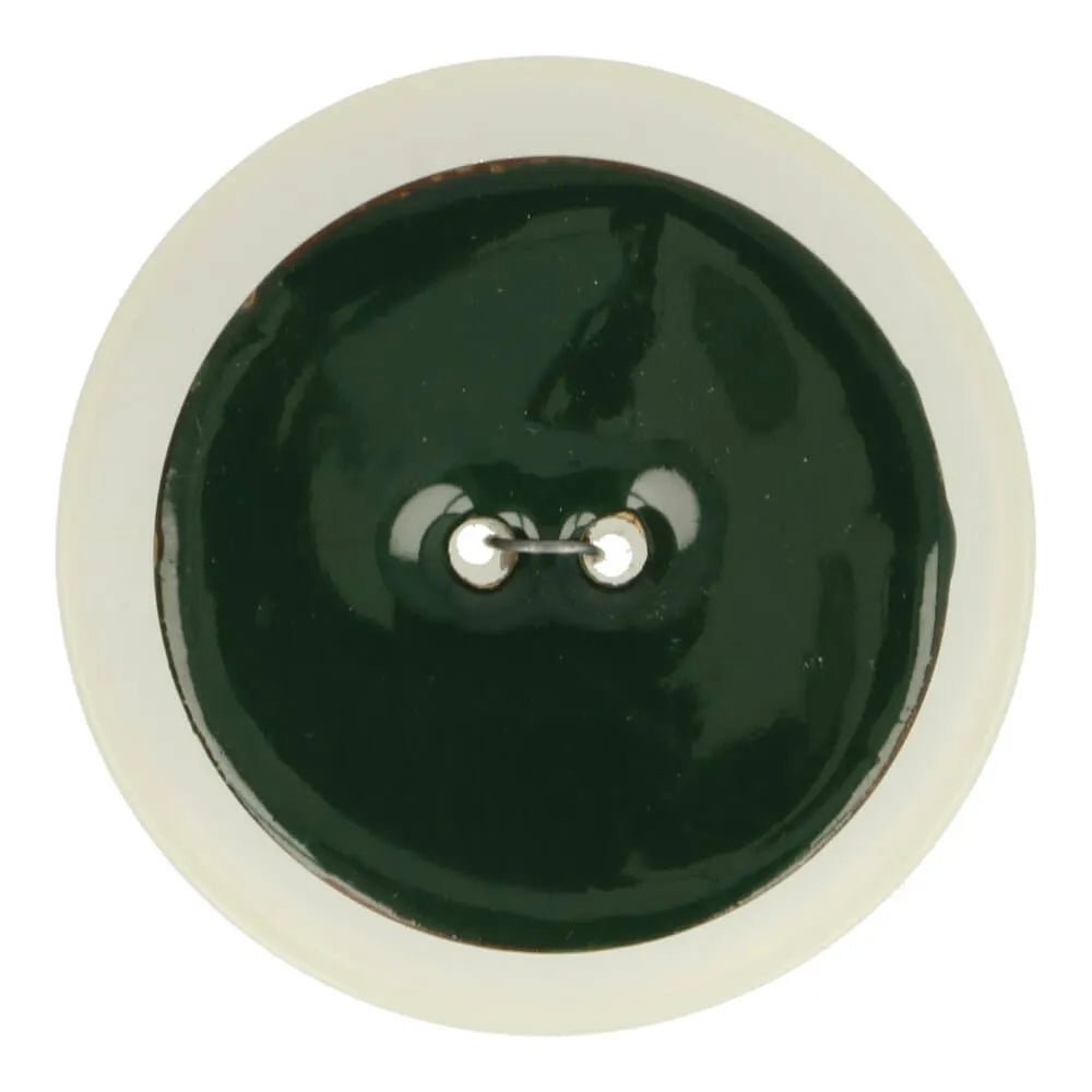 Dark green enamel coconut button – 40 mm – available online at Šarlotes audumi
