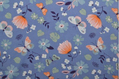 Tissu viscose à motif papillons et fleurs 100 g/m²
