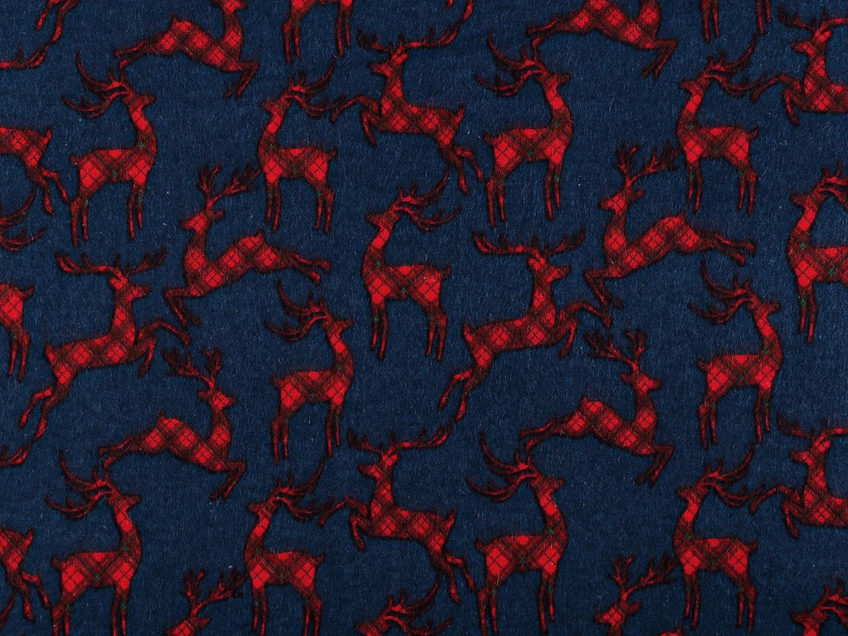 Christmas cotton flannel with reindeer on blue - available online at Charlotte's Fabrics