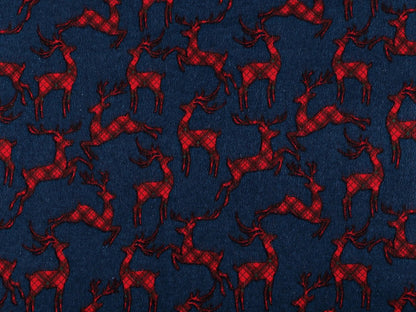 Christmas cotton flannel with reindeer on blue - available online at Charlotte's Fabrics