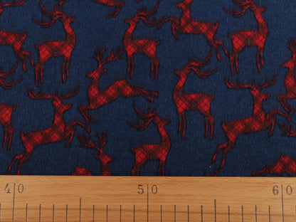 Christmas cotton flannel with reindeer on blue - available online at Charlotte's Fabrics