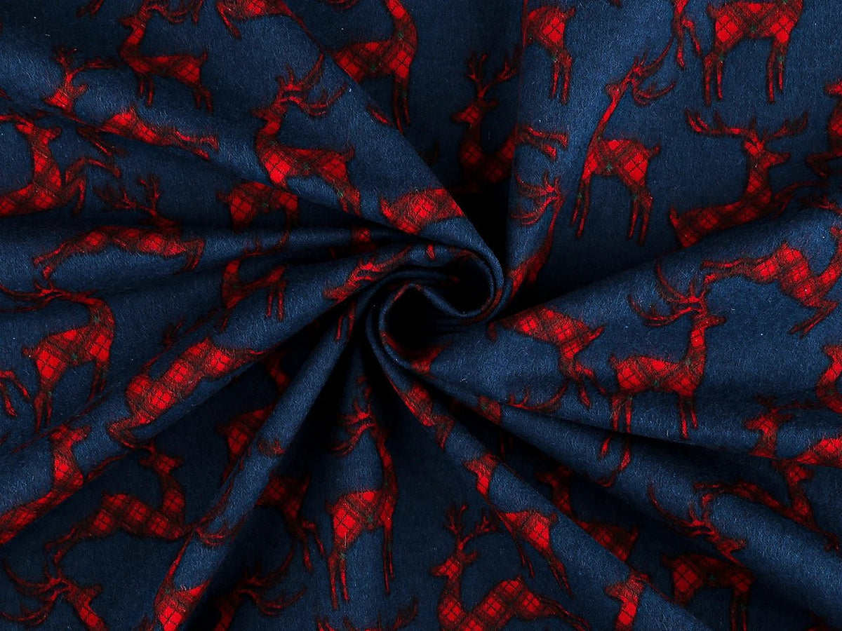 Christmas cotton flannel with reindeer on blue - available online at Charlotte's Fabrics