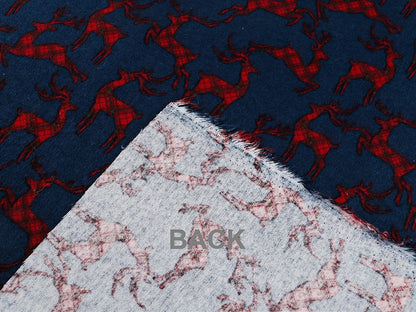 Christmas cotton flannel with reindeer on blue - available online at Charlotte's Fabrics
