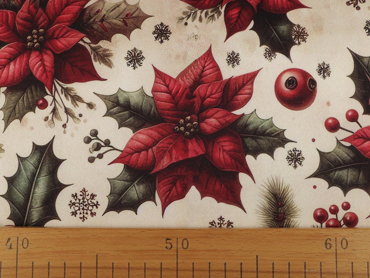 Image of Christmas satin fabric with poinsettias – available online at Charlotte's Fabrics
